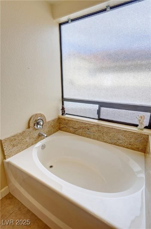 full bath with a bath and tile patterned floors