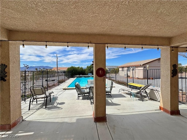 exterior space with fence and a fenced in pool