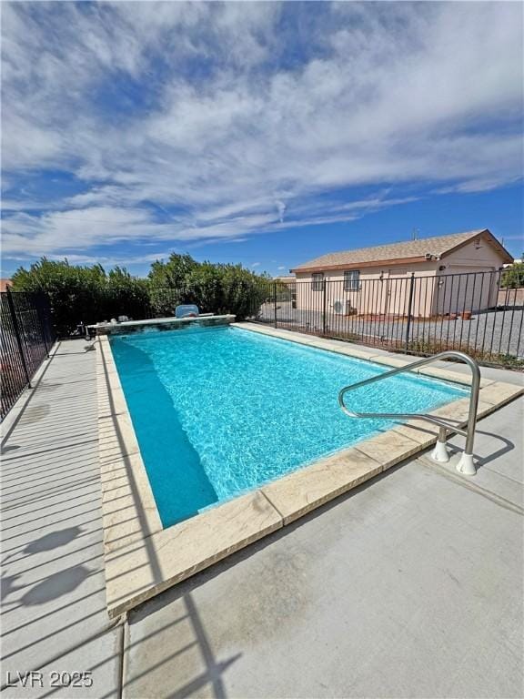 view of swimming pool featuring fence, a fenced in pool, and a patio