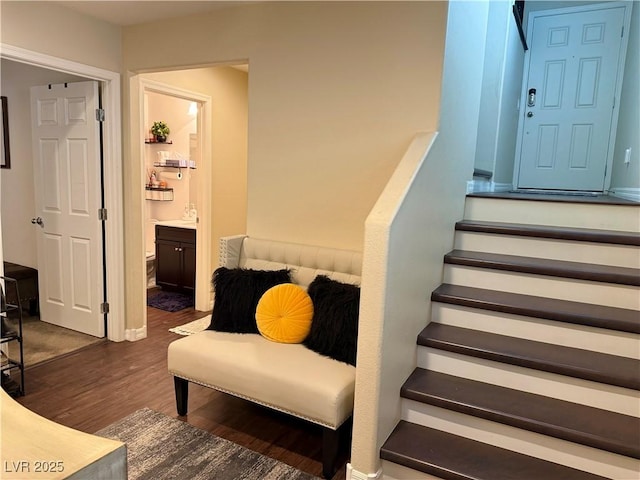 stairs with wood finished floors