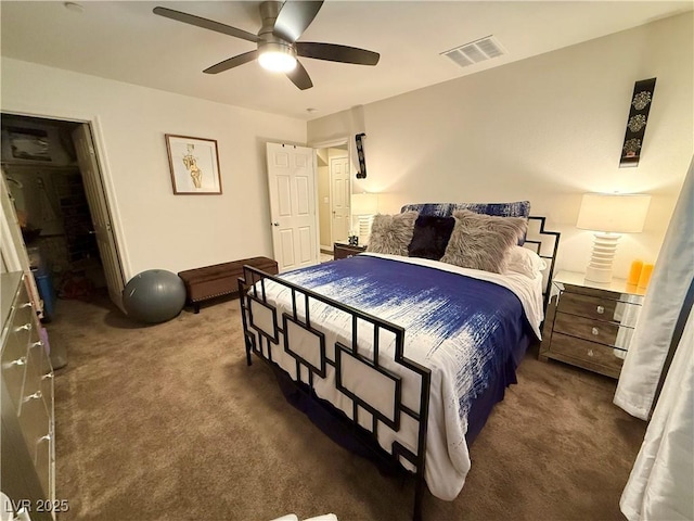 carpeted bedroom featuring visible vents and a ceiling fan