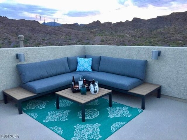 exterior space featuring outdoor lounge area and a mountain view