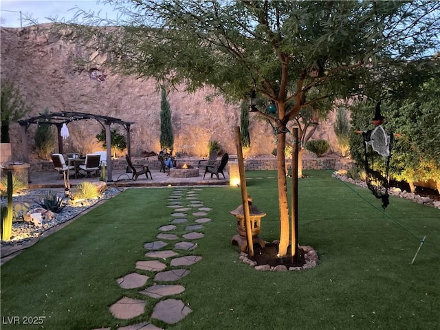 view of home's community featuring a patio, an outdoor fire pit, a lawn, and a pergola