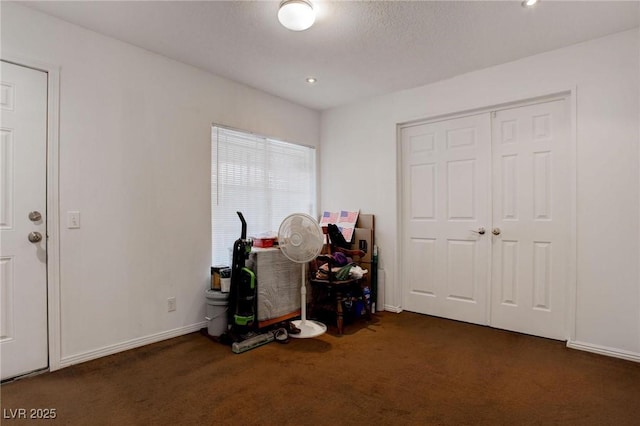 interior space with baseboards and recessed lighting