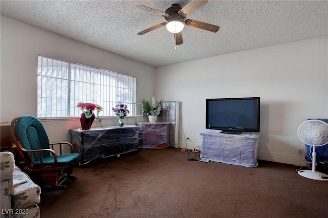 carpeted office with a ceiling fan and a textured ceiling