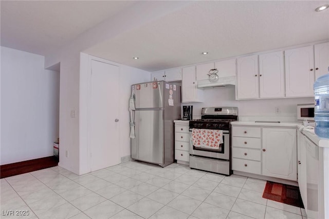 kitchen featuring white cabinets, under cabinet range hood, stainless steel appliances, and light countertops