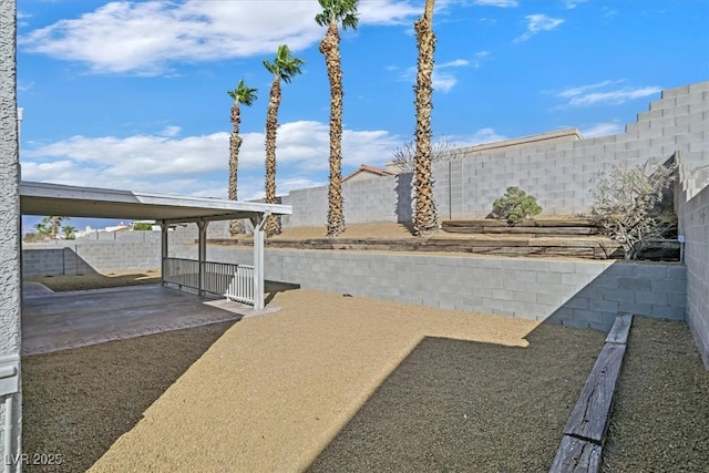 view of yard featuring a patio area and a fenced backyard