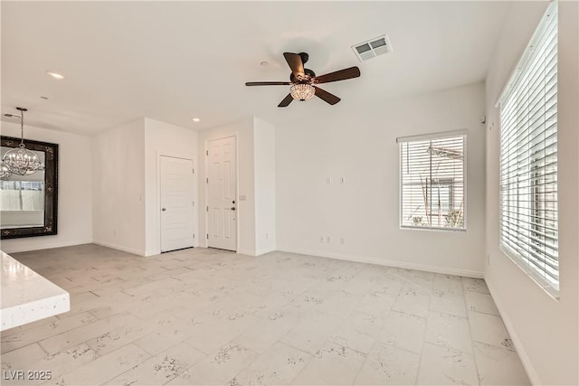 empty room with baseboards, visible vents, and recessed lighting