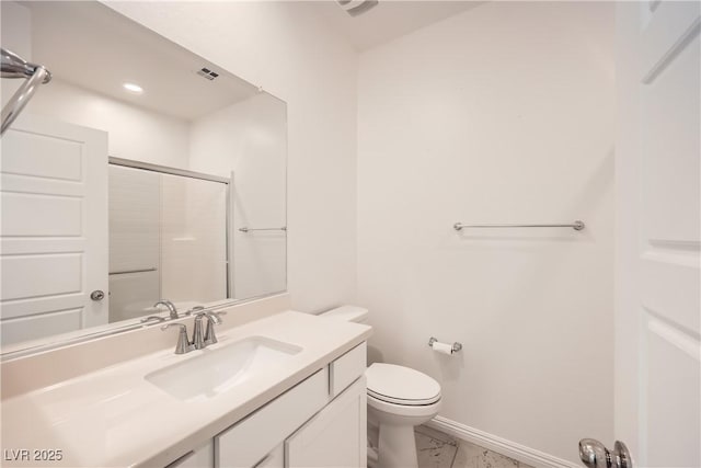 bathroom with marble finish floor, toilet, vanity, baseboards, and walk in shower