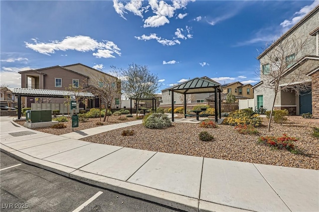 view of community featuring a gazebo and a residential view