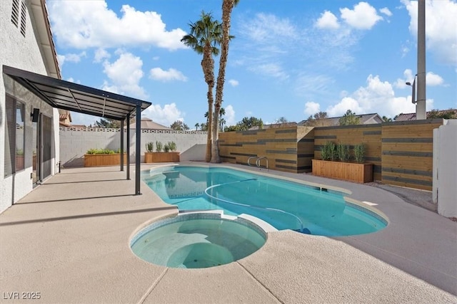 view of pool featuring a patio area, a pool with connected hot tub, and a fenced backyard