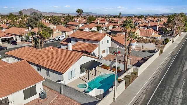 birds eye view of property with a residential view and a mountain view