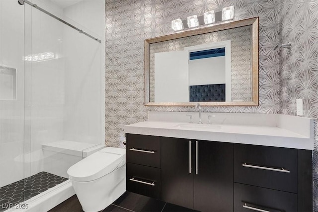 full bath with vanity, a shower stall, toilet, and wallpapered walls