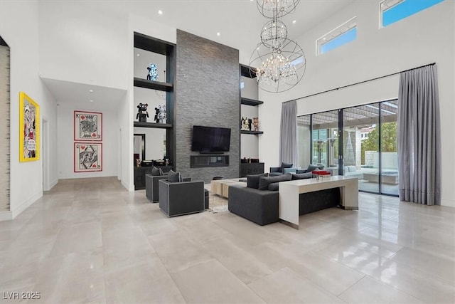 living room with light tile patterned floors, built in features, a towering ceiling, a notable chandelier, and recessed lighting