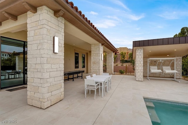 view of patio featuring outdoor dining area