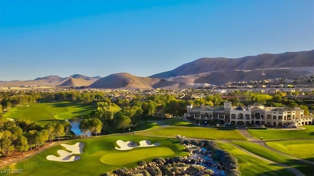 surrounding community with a mountain view and golf course view