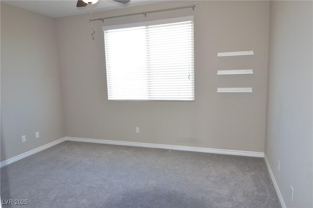 empty room with ceiling fan, baseboards, and carpet flooring