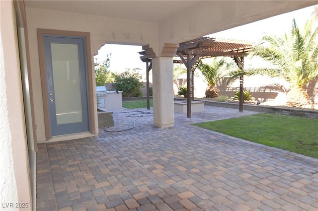 view of patio featuring a pergola