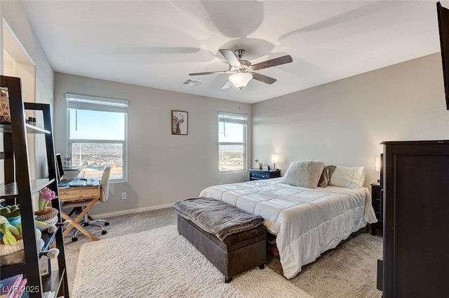 bedroom with light carpet, visible vents, ceiling fan, and baseboards