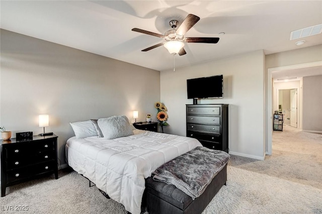 bedroom with ceiling fan, light colored carpet, visible vents, and baseboards