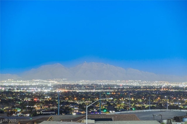 property view of mountains featuring a city view