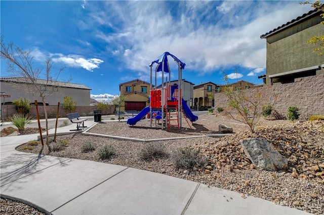 communal playground featuring fence