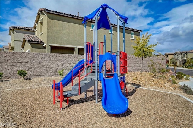 community jungle gym featuring fence