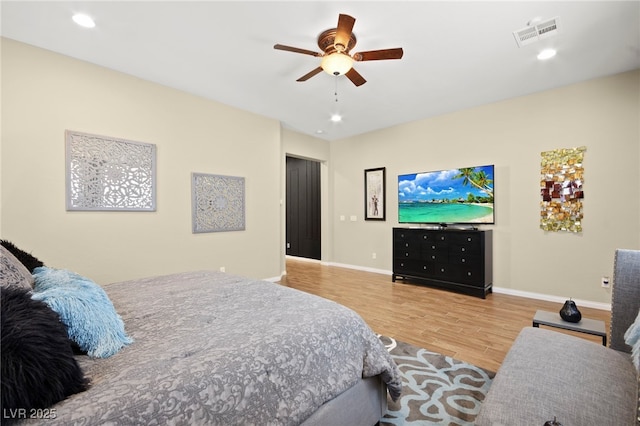 bedroom with wood finished floors, visible vents, baseboards, recessed lighting, and ceiling fan