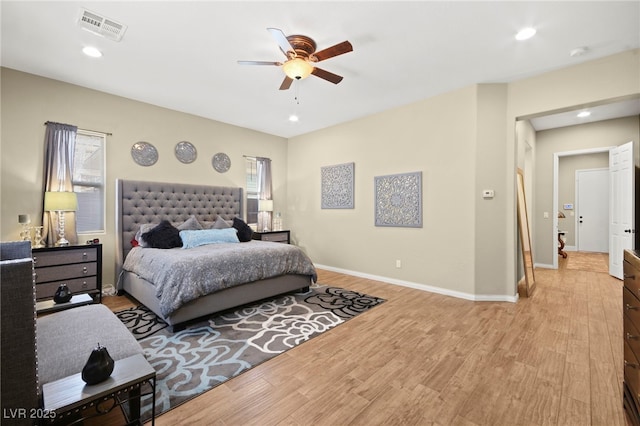 bedroom featuring recessed lighting, visible vents, baseboards, and light wood finished floors