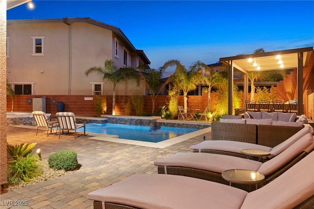 view of pool featuring an outdoor living space, a fenced in pool, a patio, and a fenced backyard