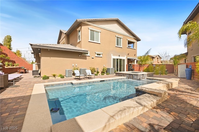 view of pool featuring a fenced in pool, fence, an in ground hot tub, central AC, and a patio area