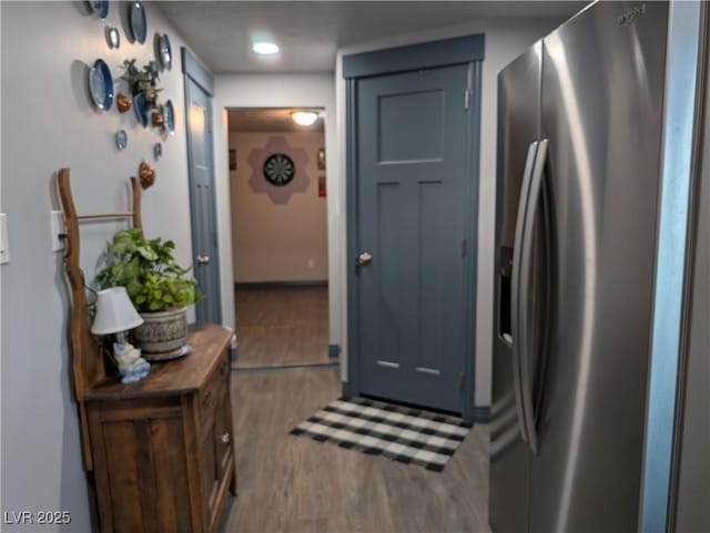 kitchen with wood finished floors and stainless steel fridge with ice dispenser