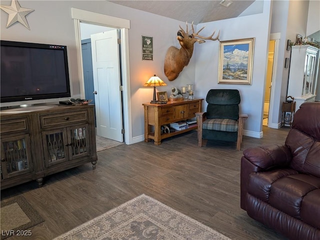 living room with wood finished floors and baseboards