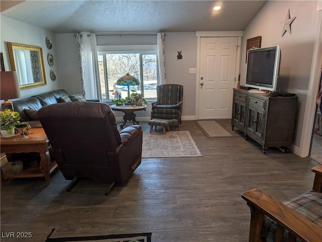 living room with dark wood-type flooring, baseboards, lofted ceiling, recessed lighting, and a textured ceiling