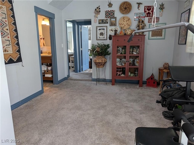 interior space with carpet flooring and baseboards