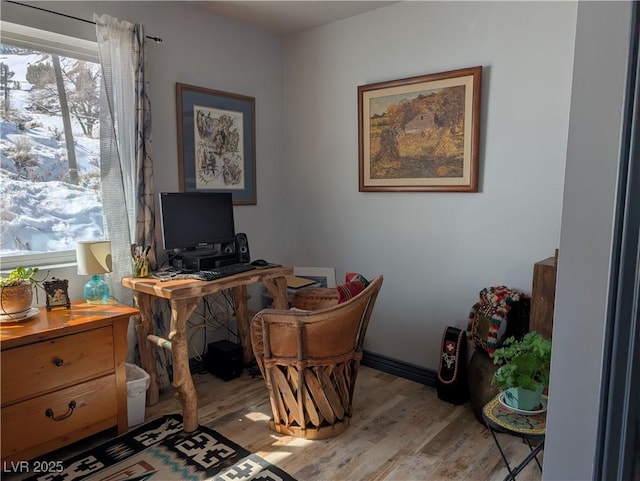 home office featuring light wood-style floors