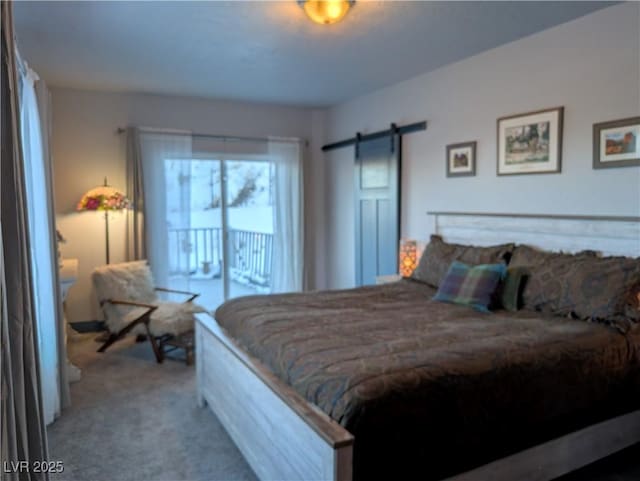 bedroom with carpet, a barn door, and access to outside