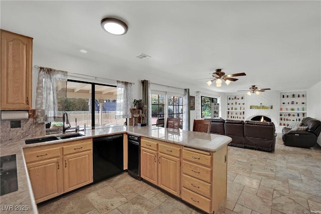 kitchen with dishwasher, a peninsula, light countertops, a brick fireplace, and a sink