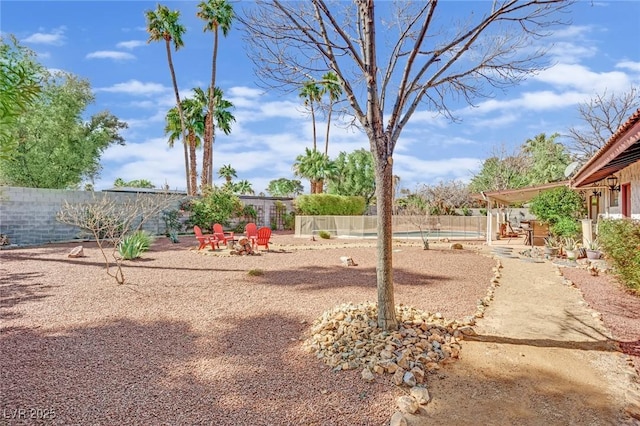 view of yard featuring a patio area and a fenced backyard