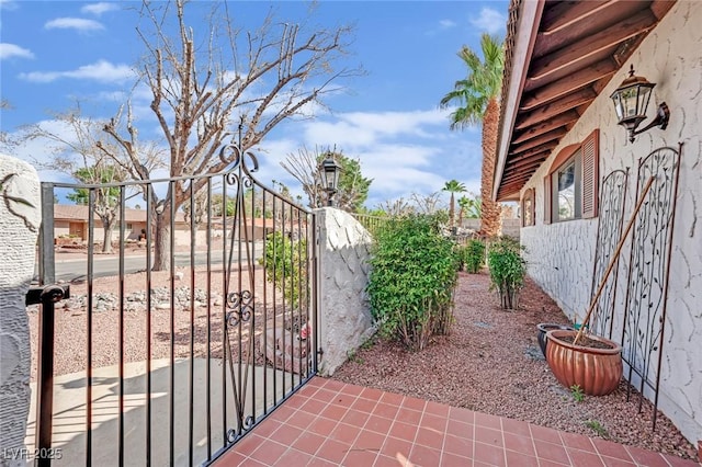 view of gate with fence