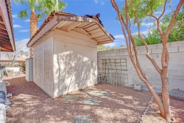 view of shed featuring a fenced backyard