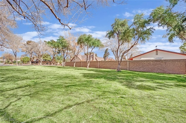 view of yard featuring fence