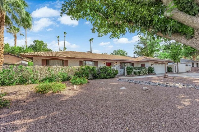 3681 S Rosecrest Cir, Las Vegas, NV 89121 - ranch-style home with stucco siding, a garage, a tiled roof, and driveway