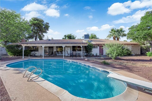 3681 S Rosecrest Cir, Las Vegas, NV 89121 - swimming pool with a patio area and a diving board