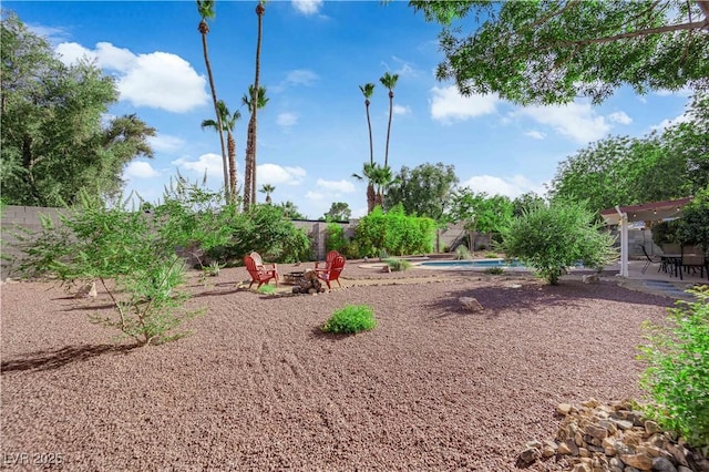 3681 S Rosecrest Cir, Las Vegas, NV 89121 - fenced backyard with an outdoor fire pit and a patio