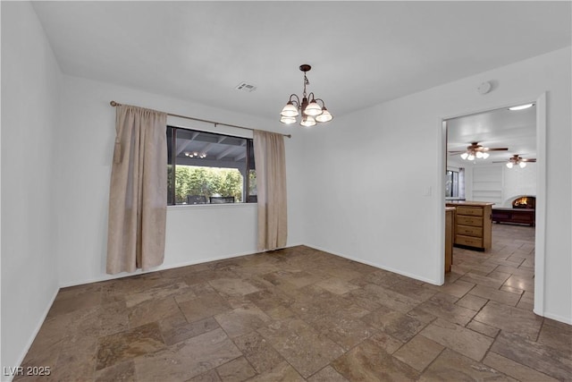 3681 S Rosecrest Cir, Las Vegas, NV 89121 - unfurnished room with stone tile flooring, a chandelier, ceiling fan, and a warm lit fireplace