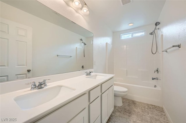 bathroom with toilet, visible vents,  shower combination, and a sink