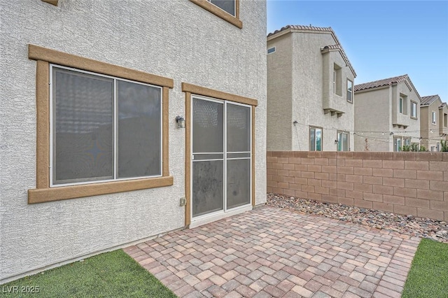 view of patio / terrace featuring fence