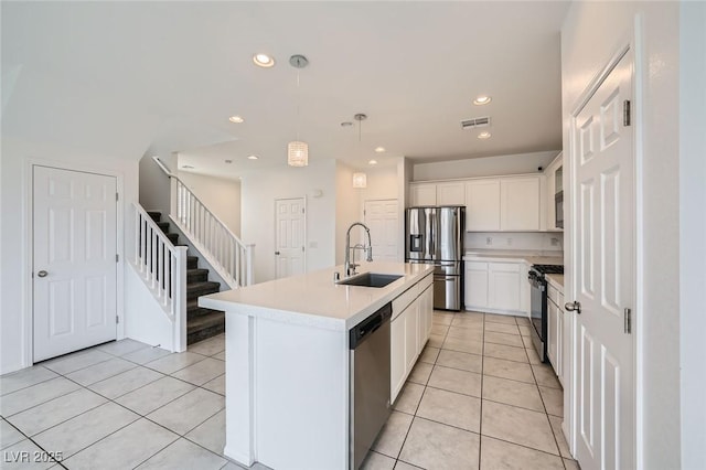 kitchen with light tile patterned floors, visible vents, appliances with stainless steel finishes, light countertops, and a sink