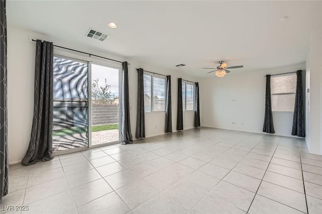 unfurnished room featuring light tile patterned floors, visible vents, a ceiling fan, and recessed lighting